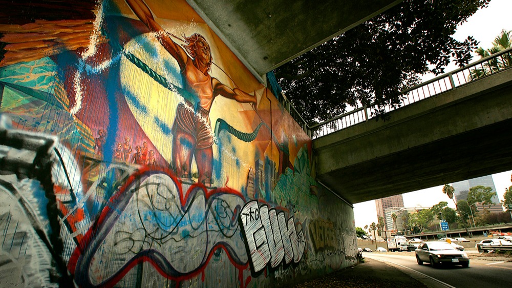 Whitewashed without Notice, Judy Baca’s Iconic Freeway Mural Is Being Fully Restored
