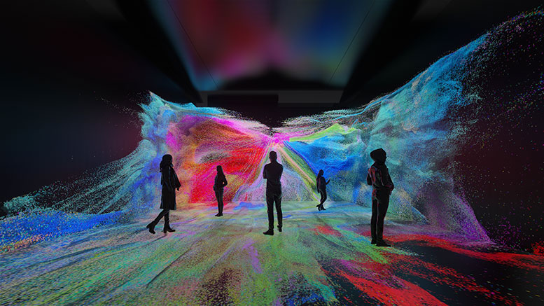 Five figures stand in a darkened room with swirling colors on the walls