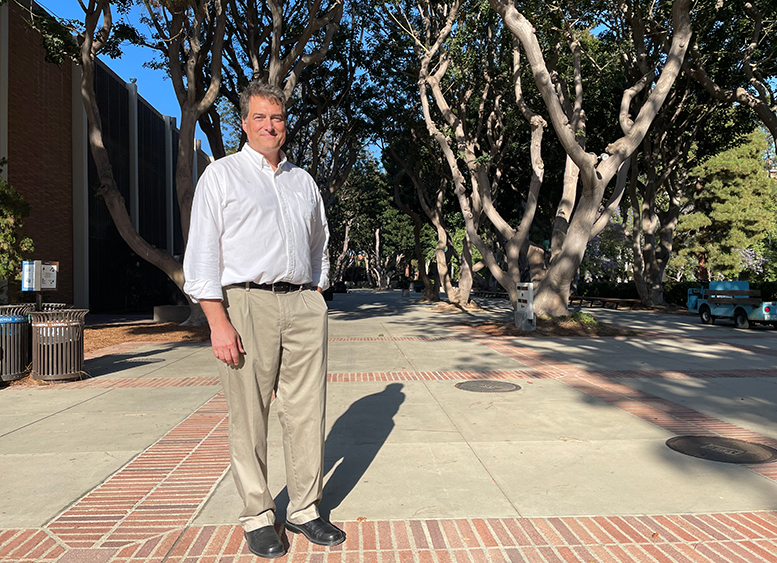 Jason Corbett stands in the sculpture garden