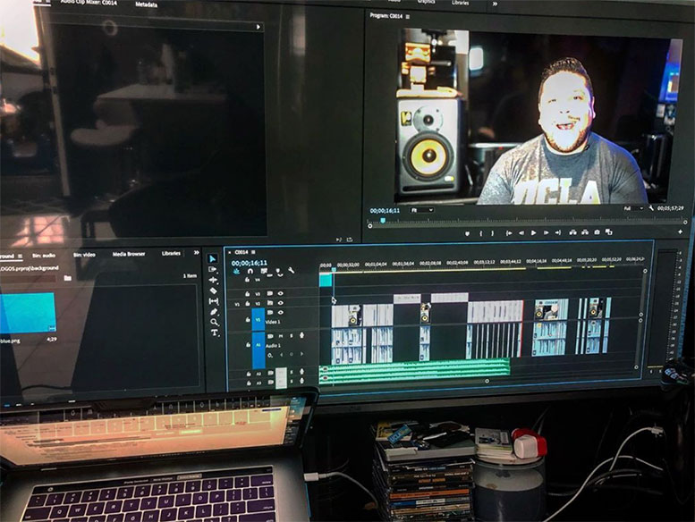 A student's face on a computer screen in a video editing program.