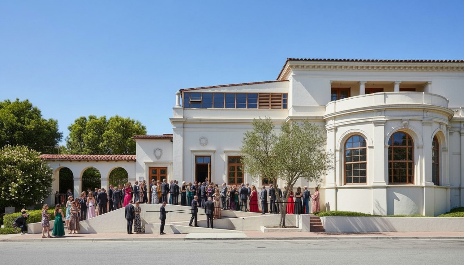 Large group of event attendees gathered outside the Ebell of Los Angeles on a sunny day.